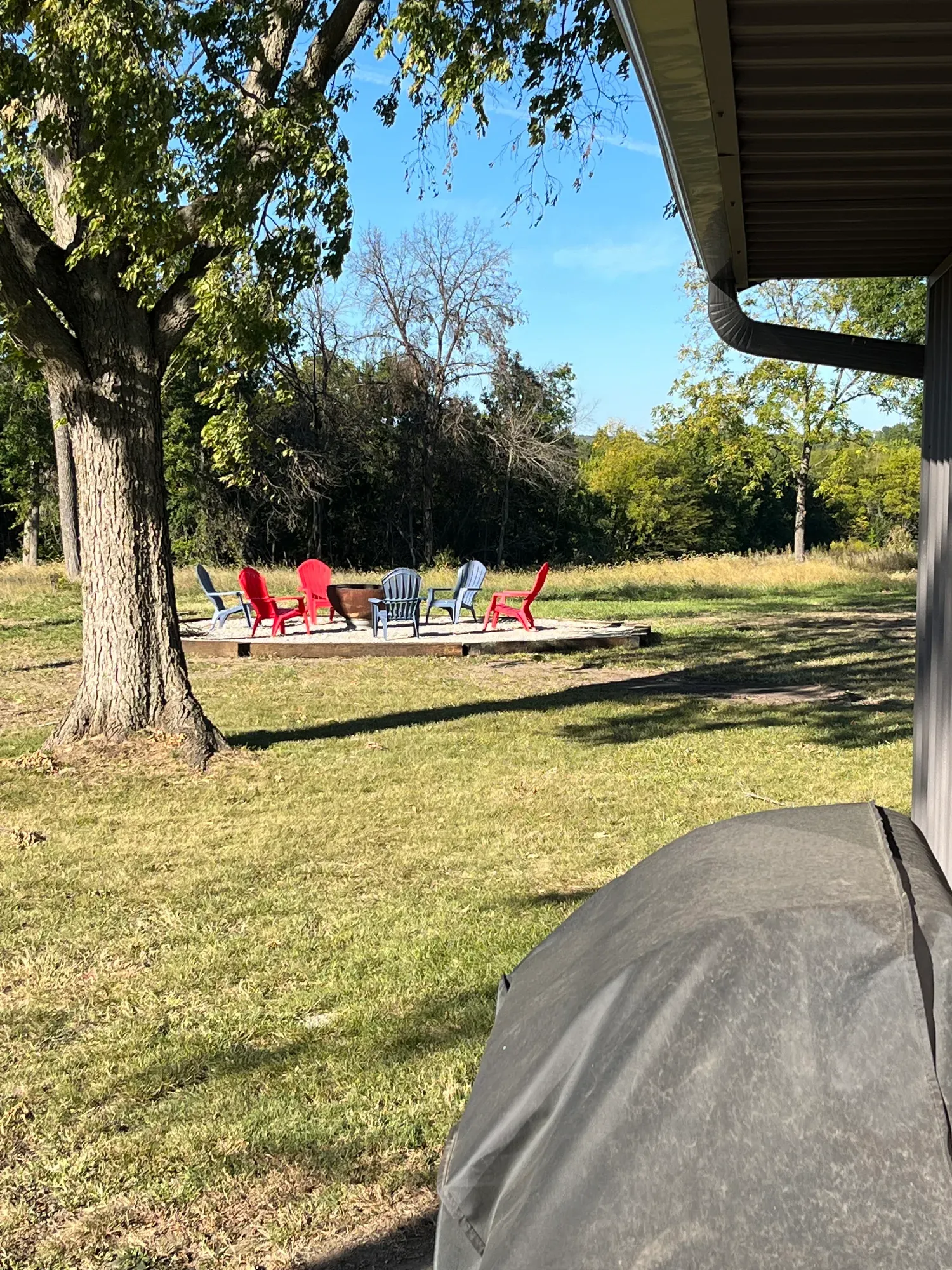 View from the porch across the yard to the fire pit